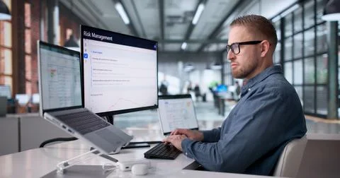 Young Professional Operating ERP System On Laptop For Business Resource Manag Stock Photos