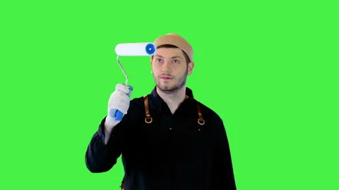 Young professional painter decorator point roller brush to difficult places for Stock Footage 157978019
