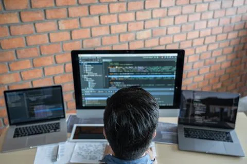 Young Professional programmer working at developing programming and website w Stockfoto's