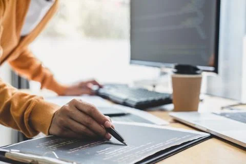 Young Professional programmer working at developing programming and website w Stock-Fotos