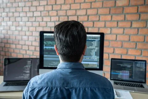 Young Professional programmer working at developing programming and website w Stock-Fotos