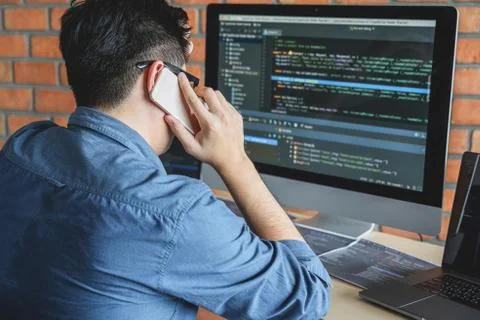 Young Professional programmer working at developing programming and website w Stockfoto's