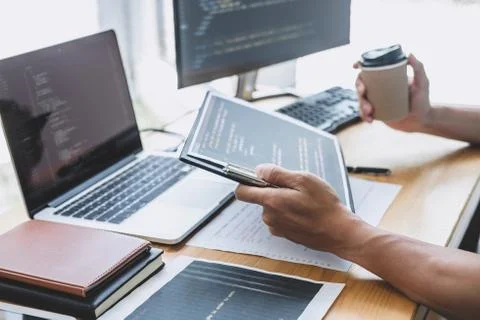 Young Professional programmer working at developing programming and website w Stock-Fotos