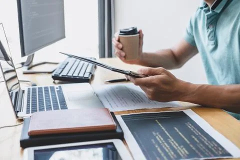 Young Professional programmer working at developing programming and website w Stock-Fotos