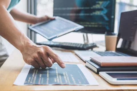 Young Professional programmer working at developing programming and website w Stockfoto's