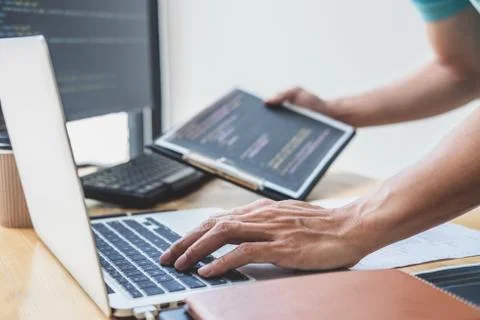 Young Professional programmer working at developing programming and website w Stockfoto's