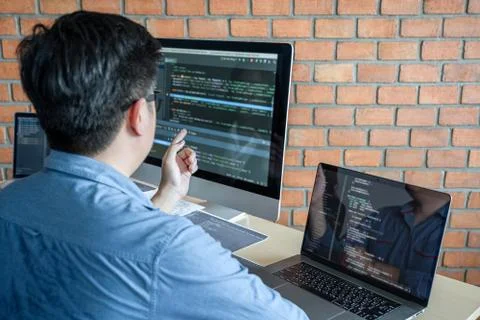 Young Professional programmer working at developing programming and website w Stockfoto's