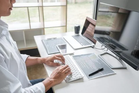 Young Professional programmer working at developing programming and website w Stock-Fotos