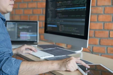 Young Professional programmer working at developing programming and website w Stock-Fotos