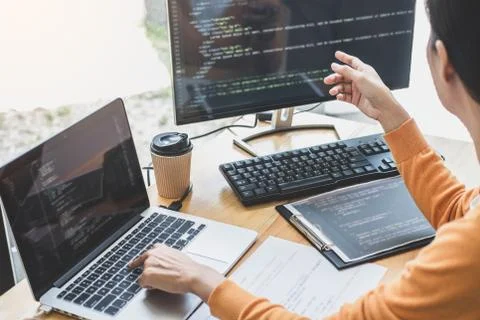 Young Professional programmer working at developing programming and website w Stock-Fotos