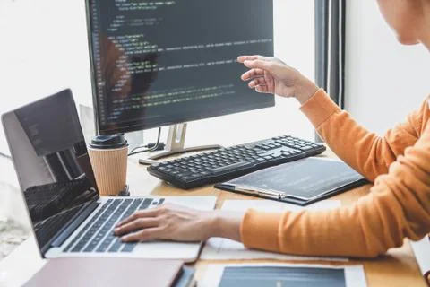 Young Professional programmer working at developing programming and website w Stock-Fotos