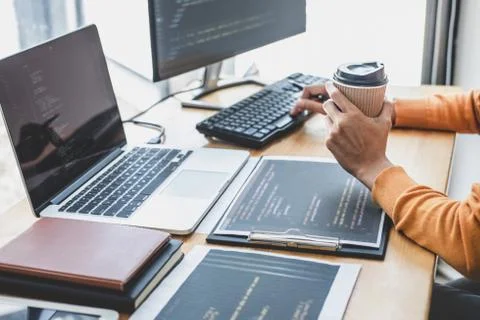 Young Professional programmer working at developing programming and website w Stockfoto's