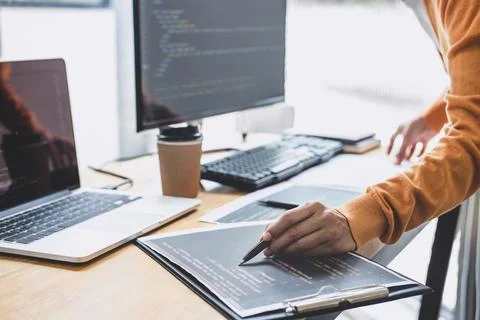 Young Professional programmer working at developing programming and website.. Stock Photos