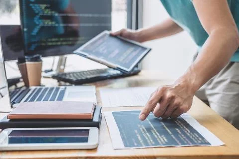 Young Professional programmer working at developing programming and website.. Stock Photos