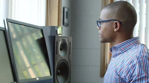 Young professional standing at his computer in the office Stock Footage 53463952