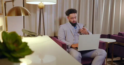 A Young Professional Successfully Working Remotely in a Modern Office Stock Footage 293295844