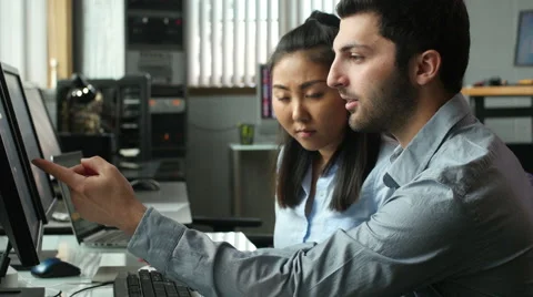 Young professional team working on a computer in modern office 動画素材 49197958