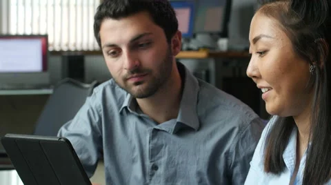 Young professional team working on tablet, in office,  close-up Stock Footage 49198551
