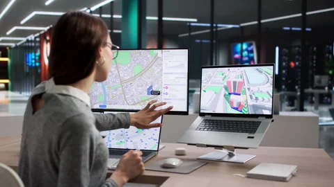 Young Professional Using GIS Software To Plan Land Stock Footage 334927300