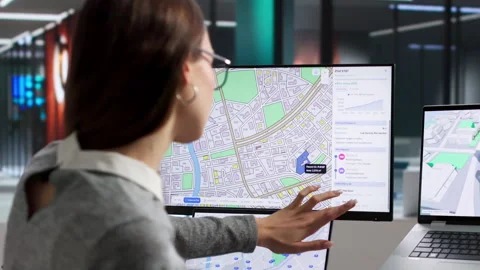 Young Professional Using GIS Software To Plan Land Stock Footage 334928500