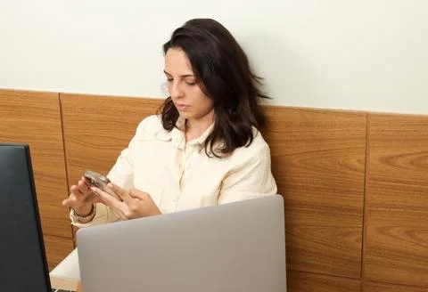 Young professional woman multitasking at work Stock Photos