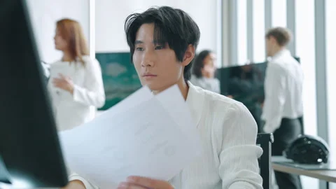Young Professional Working on Computer in Modern Technology Office Stock Footage 348335905