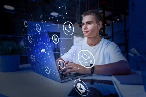 Young professional working on human resources tasks with digital interface in Stock Photos