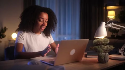 A Young Professional is Working Late into the Evening at Home with Focus and Stock Footage 282035877