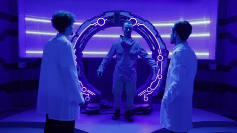 Young professionals having space mission in futuristic, neon lit interior Stock Footage 242651015