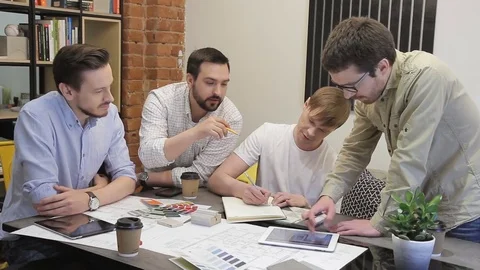 Young professionals met at modern office to discuss business project indoors. Stock Footage 83027012