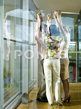 Young professionals in office exercising motivation training Stock Photos