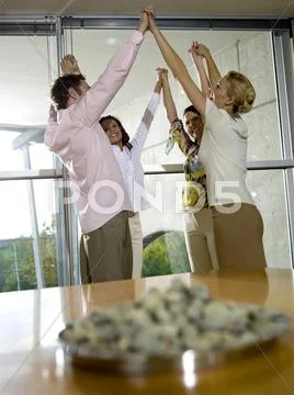 Young professionals in office exercising motivation training Stock Photos