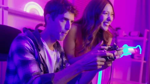 Young professionals  play video games together live streaming their matches.. Stock Footage 236262174