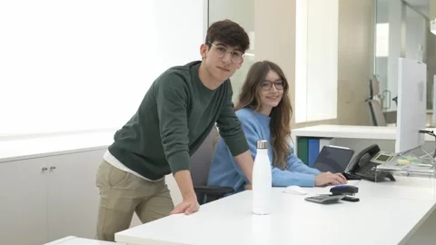 Young professionals posing in modern office Stock Footage 310996132