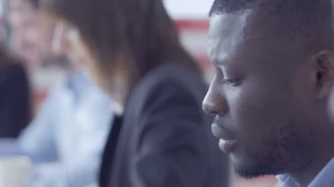 Young professionals sitting and working on the computers at the office Stock Footage 74292454
