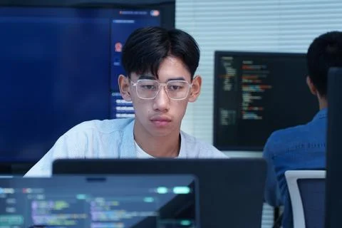 Young Programmer Coding on a Computer Foto stock