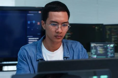 Young Programmer Developing Digital Software and AI Technology Fotos Stock