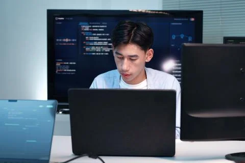 Young Programmer Developing Software on Laptop Stock Photos