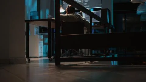 Young programmer with disability typing source code on terminal window 写真素材