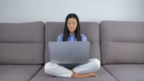 Young programmer girl typing code on laptop. Freelancaer working on notebook pc Stock Footage 172191358