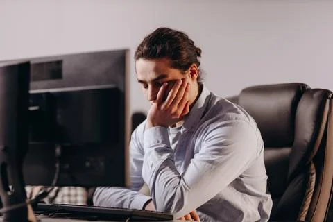 Young programmer has a problem. Software developer working on difficult task Stock Photos