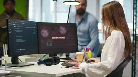 Young programmer requests help from IT experts for hacker intrusion Stock Footage 313016598