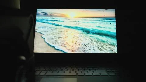 Young programmer student run assignment with laptop alone at midnight in the Stock Photos