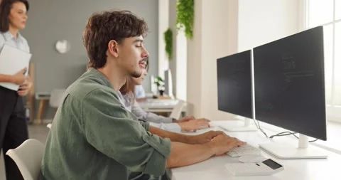 Young Programmer Typing Code at Computer During Classroom Lesson Footage 库存影片 348155892