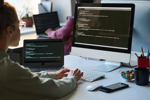 Young programmer typing security code Stock Photos