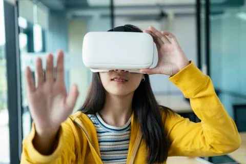 Young programmer with virtual reality glasses to testing 3D application. Stock-Fotos