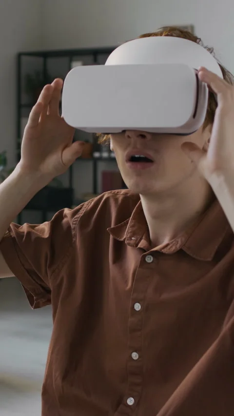 Young Programmer with VR Headset Working on Development of Innovative App Stock Footage 299242732
