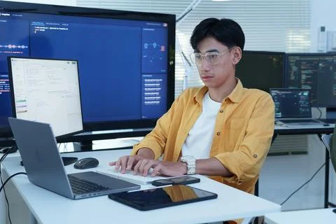 Young Programmer Working on Artificial Intelligence Software Stock Photos