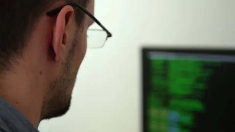 Young programmer working on a code Stock Footage 73097678