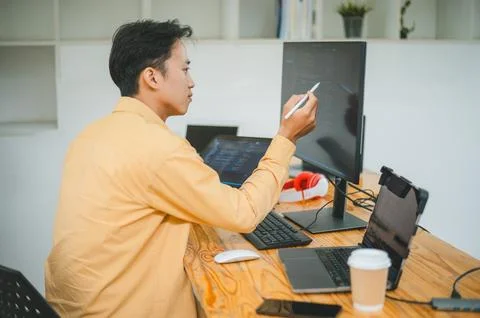 Young programmer working on coding, software development and web design in .. 写真素材